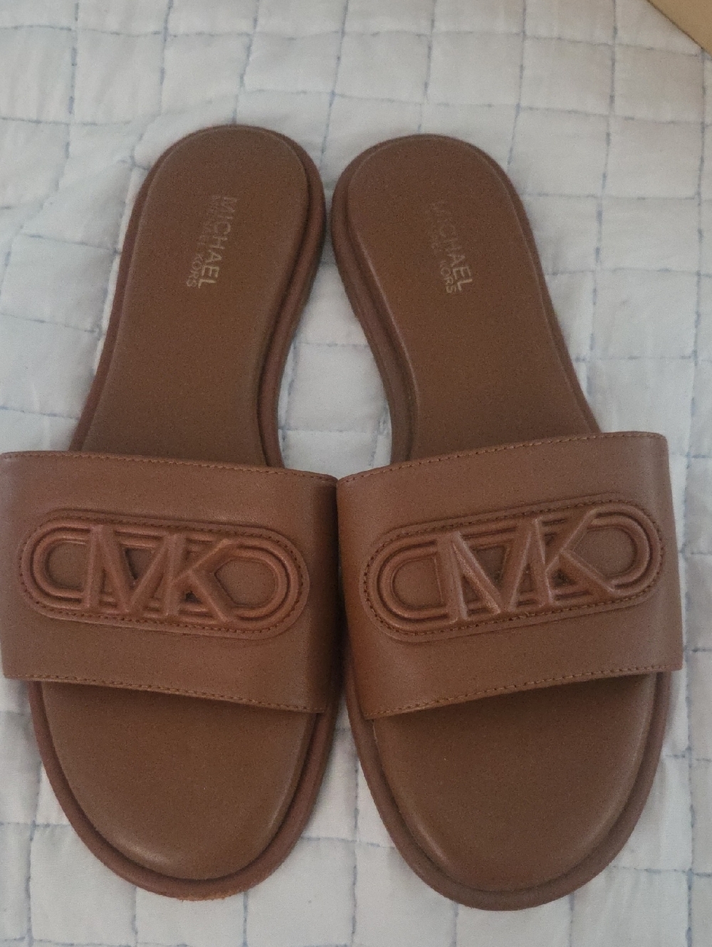 MICHAEL Michael Kors Saylor  Embossed MK Logo Slide Sandals In Luggage With Box